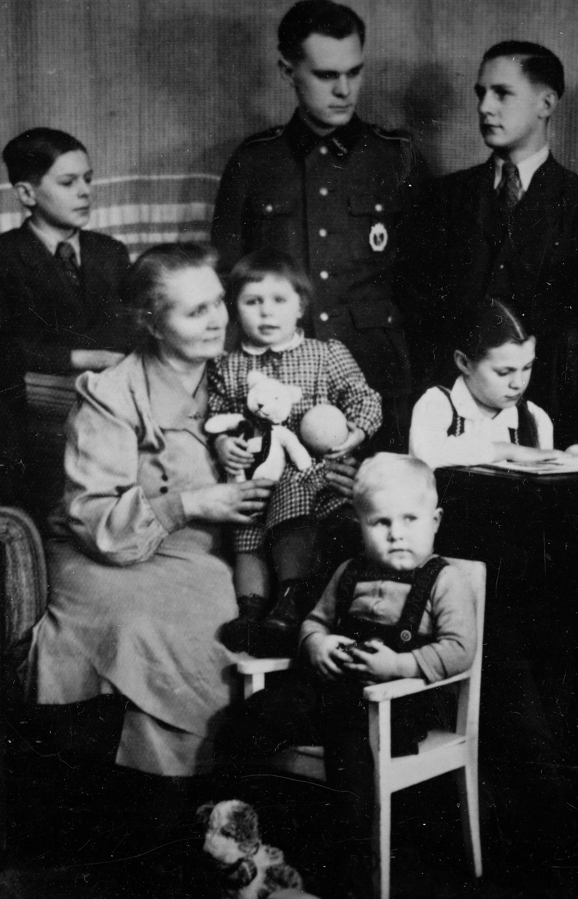 Jan Moudrý (sitting on the chair in the very front) during World War II with some of his family members