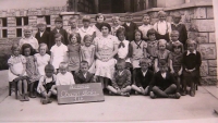 Naděžda second from the right in the central row next to a boy 

