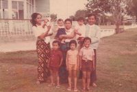 With his siblings and parents