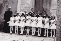 1970s, P. Damborsky with children during the first holy communion 