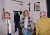 František Hýbl (on the left) showing a school exposition from the times of the Austro-Hungarian Empire / the former Minister of Culture Pavel Dostál stands in the middle / the 1990s 