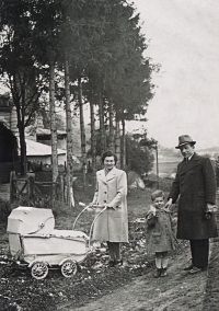 With the father, mother and brother in a pram in 1941