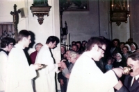 Adam Rucki celebrating his first Mass, giving wine to his father/ Český Těšín 1974