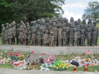 View of the bronze memorial, flowers and toys at the front (2017)