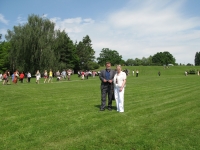 Sylvia Klánová and her husband on the Lidice plain, the memorial in the background (2010)