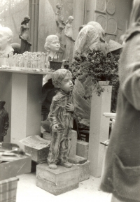 Marie Uchytilová standing on the right, on the left it a small model of the sculptural group of children from Lidice and the statue Prisoner (1989)