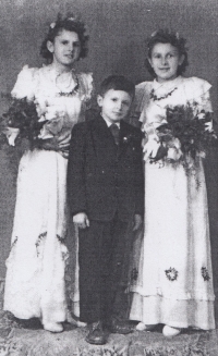 With her siblings. Around 1950