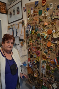 At the collection of scout patches, which she received during the years of scouting with her husband Lubomír Kantor