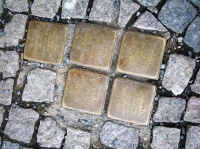 Stones of the disappeared on Masaryk square in Říčany, in front of the house with no. 7 – memorial to the Jewish classmate Pavel Fišer and his family