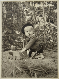 Augustin in September 1940 - playing with a train in the garden