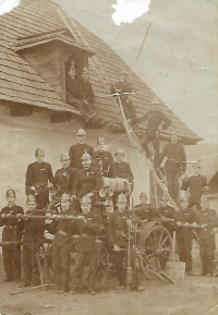 The Fire fighters in Újezd. 1911. František Bock, the brother of the witness´s grandfather from her father's side, stands first on the ladder. He went to America in 1921, then he came to get married after a while, and then left forever.
