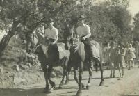 Josef Bock (on the left), a brother of the witness, in a ceremonial procession during municipal harvest festival. He rides with a friend on Bock's family own horses. Újezd 1961.
