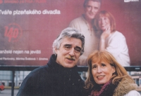 Monika by her billboard with her husband Pavel 

