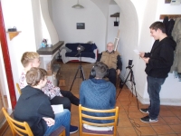 The witness with students during filming