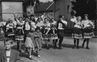 Alice (the blond on front) in traditional costume on harvest festival in Pohořelice, 1956
