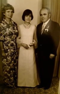 Alena with her parents, a wedding photograph