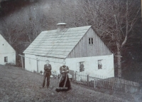 His grandmother Anna Wolfová with her son Josef (the witness's father) in front of the family house in Chebzí