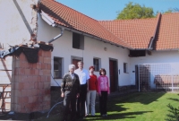 The Brož family at the house in Radňov (photo from 2006), from the left: František Brož, son Peter, grandchildren Markéta and Marek
