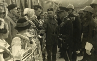 Nymburk 1938. Presentation of silver fanfare trumpet. Colonel Zdeněk Vltavský in helmet, partially covered by Brig. Gen. Čihák