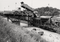 Dumping of excavated ore into wagons from a cargo ramp 