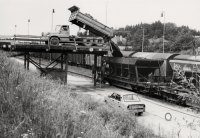 Dumping of the mined rock into the rail wagons from the loading ramps 