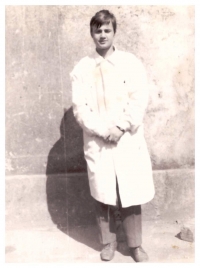 Miroslav Kučera at the barracks yard in medical work clothes
