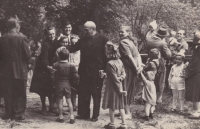 After the Sunday Mass in Andělka. The photograph shows mostly families of the forcibly removed farmers. Also shown Bedřich Hanauer Sr. (wearing a hat) with his wife