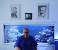 Ladislav Vitoul in 2020 under the paintings of his grandfather (Josef Vitoul) and his father (Ladislav Vitoul)
