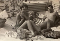 With parents and sister on vacation, photographed on a nudist beach in the GDR, 70s