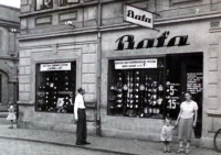 The Niederle family in Ervěnice in front of the Baťa shop, managed by the witness's father, 1930s