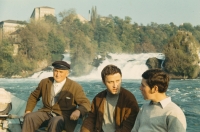 At a waterfall in Switzerland with his landlord, Mr Arnold Van der Waerden on the left; 1969 