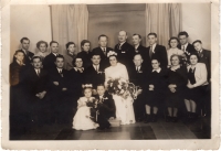 Wedding of witness' brother and Vratislav Hrdý and Bohuna Ročková.  Witness' parents sitting on groom's left, Josef Hrdý as a child in front of the groom, brother Milan is standing second from the right. 1951