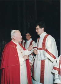 John serving as a deacon at the papal mass along with John Paul II. in Rome in 1990