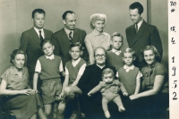 1952, April. his father on the left, second row, his wife, Olga, in front of him, their sons Pavel and Ivan, next to the father his brother, Ivan, with his wife 

