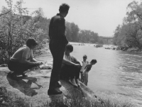 Jana Krčmářová's family with visitors on the rocks along the Sázava river, the 1960s 