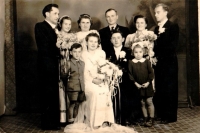 As a bridesmaid at the wedding, Maria in the upper row from the left