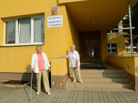 Františka with a friend in front of the Zličín Primary School