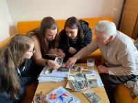 Viewing photos with the team from the project Stories of Our Neighbours