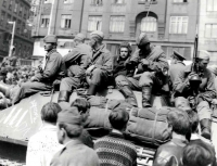A close-up photo of a Soviet tank crew in front of the main railway station in Brno 