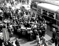 Crowds of Brno citizens at Soviet tanks in front of the main railway station in Brno 
