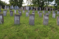 Herman Grossmann's grave at the Jewish cemetery in Ivančice. Group of graves of perished persons from refugee camp with uniform tombstones