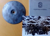 Remembrance of the war in Janovice nad Úhlavou - a Spartakiad mark, a military book and a picture from a winter exercise in Dobrá Voda. Pavel Mahdal is first from the left