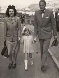 With her parents, on a walk along the waterfront, Prague, 1949