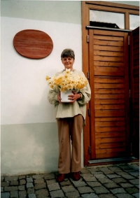 Eliška in front of the restored Municipal House with sixty daffodils on her sixtieth birthday, 2004 