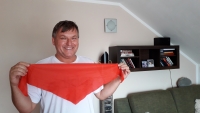 Jaroslav Janota in 2020. The witness posing with a pioneer handkerchief he wore as a child