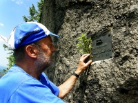 Otokar Simm at the reminder of the Sudeten German poet Kauschka, located on the Jizera Mountains rock