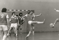Playing with Amfora [celebrities' football team] in the Slavia sports club stadium. Václav Vašák, centre, with a raised leg, wearing a headband. 1984