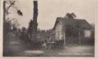 A postcard from forester's house in Dubina by her uncle, Karel Krejčí (sitting on the far right), her grandfather, Josef Krejčí (standing on the far left), 17 April 1931 
