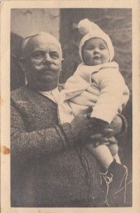 Her grandfather, František Kosina holding Věra Styblíková, Pardubice, 6 January 1935 