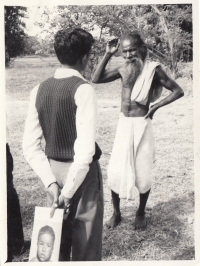 An epidemiologist is talking to an Indian man about smallpox during the disease surveillance campaign. 1970's